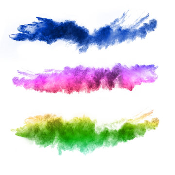 Explosion of colored powders on white background