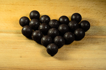 Chocolate balls lying in a form of heart