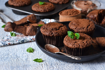 Chocolate muffins with nuts and peanut butter.