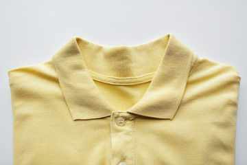 close up of polo t-shirt on white background