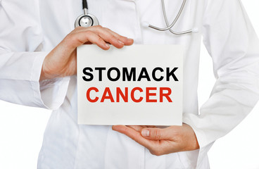 Stomack cancer card in hands of Medical Doctor