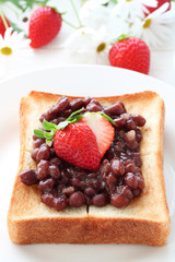 Toast with Japanese Adzuki bean paste, Strawberries and Butter on White plate