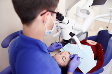 Dentist surgery having dental checkup at stomatology clinic
