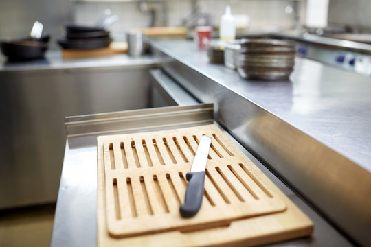 cutting board and knife at restaurant kitchen