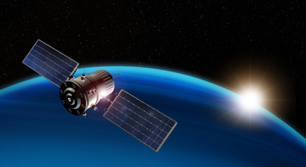 satellite orbiting the earth at sunrise