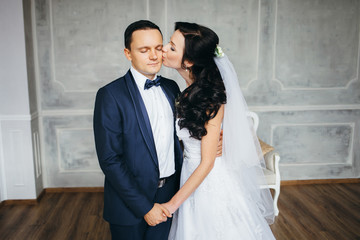 Wedding photo shoot of the newlyweds in a beautiful Studio inter