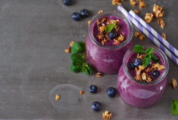 Berry yogurt with bran and oatmeal on a metal background