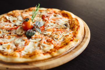 Italian pizza with mushrooms on the Board