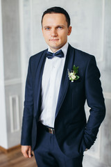 Portrait of the groom in the Studio.