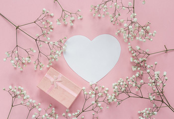 Blank paper heart-card and gift box with frame of delicate littl