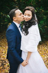 Wedding photo shoot. Beautiful groom and bride in nature.