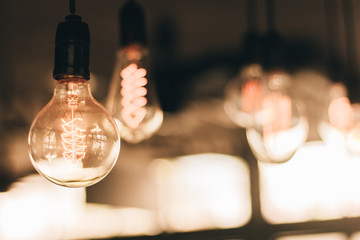 Glow old vintage ligth bulb with vintage filter (selective focus)