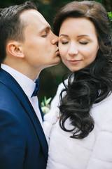 Wedding photo shoot. Beautiful groom and bride in nature.