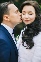 Wedding photo shoot. Beautiful groom and bride in nature.