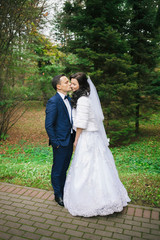 Wedding photo shoot. Beautiful groom and bride in nature.