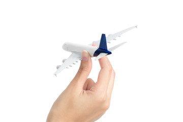 Fototapeta premium Woman hand holding model aeroplane, isolated on white background.