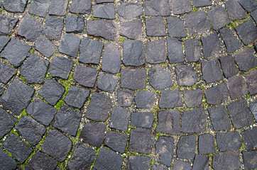 Stone pavement texture. Granite cobblestoned  background. Abstract  of old cobblestone  close-up....