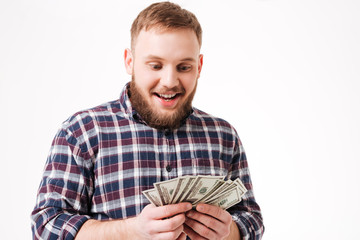 Bearded man in shirt considers money