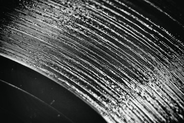 Scratched vinyl record with the add of scratches effect and film noise for achieving retro style