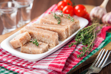 Homemade jelly meat with mustard  on the table. Holodets. Selective focus. Copy space.