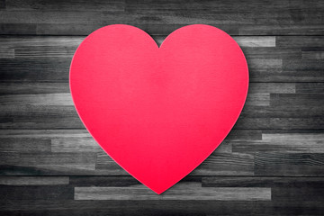 Obraz na płótnie Canvas Red heart paper on grunge wood table