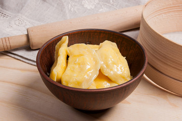 Fresh boiled varenyky or dumpling with cottage cheese or curd in