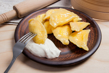 Close up view of boiled varenyky or dumpling with cottage cheese