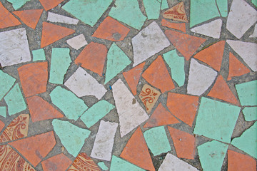 Old abstract texture or background colorful mosaic on the floor of broken ceramic tiles