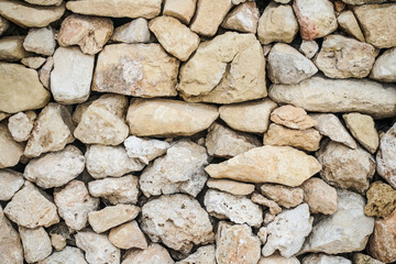Stacked stone wall background - texture