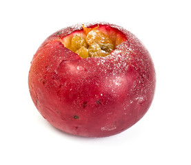Baked apple with raisins on a white background