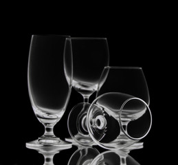 Shot of empty crystal glasses on black isolated. 