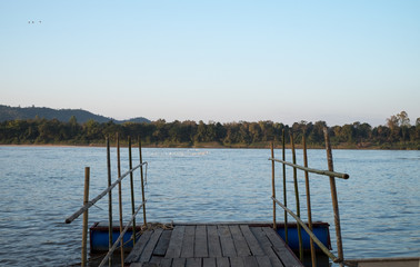 Naklejka premium wooden terrace by the Mekong river at Chiang Khan District, Loei Province, Thailand