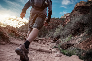 Hiker walking on the rocky path