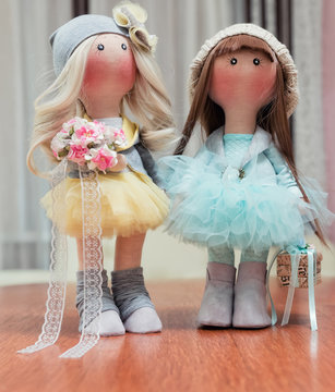 Two handmade rag dolls - blonde and brown-haired