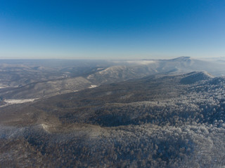 Fototapeta na wymiar Aerial landscape of winter mountain forest.
