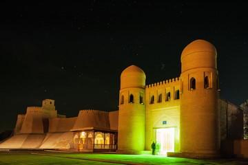 Oriental building with illuminated entrance at night.The city of Khiva, Uzbekistan
