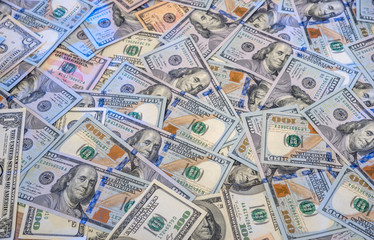 Fototapeta premium Pile of new and old one hundred dollar bills bills.