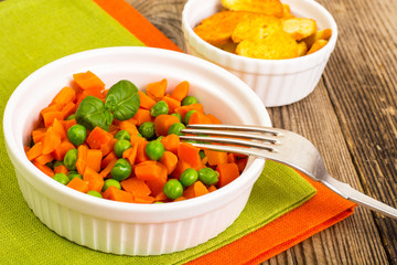 Carrots and green peas on a couple of Diet