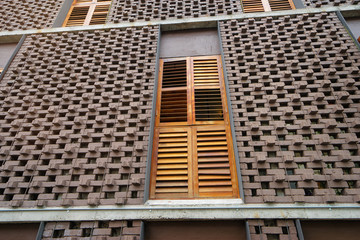 Architecture and design. Brick facade with wooden windows.