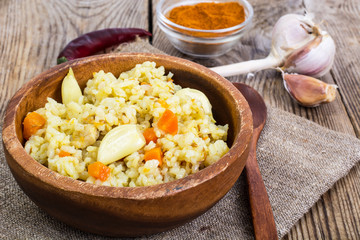 Pilaf, rice, meat, carrots, garlic