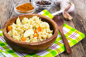 Pilaf, rice, meat, carrots, garlic