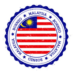 Borneo flag badge. Vintage travel stamp with circular text, stars and island flag inside it. Vector illustration.
