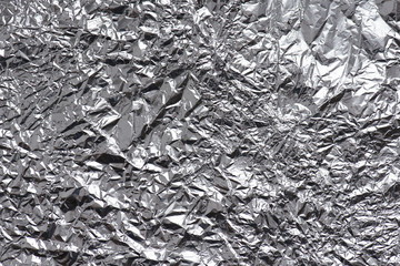Very crumpled silver foil, large texture, background