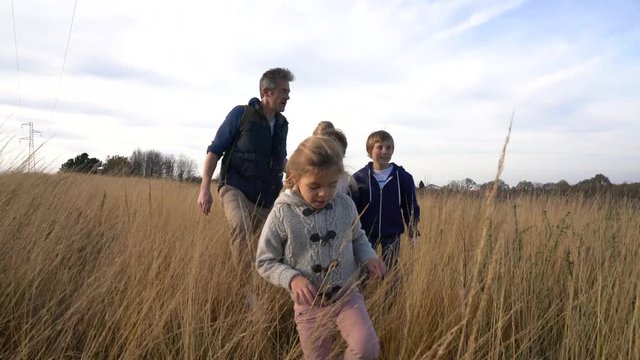 Teacher taking kids to countryside to explore nature