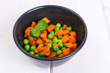 Mix boiled vegetables in a salad bowl