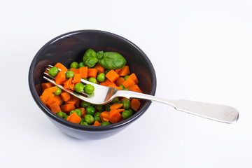 Mix boiled vegetables in a salad bowl