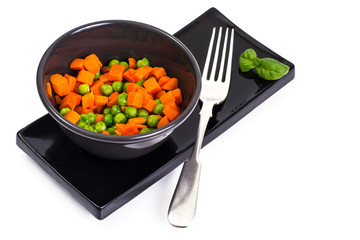 Mix boiled vegetables in a salad bowl