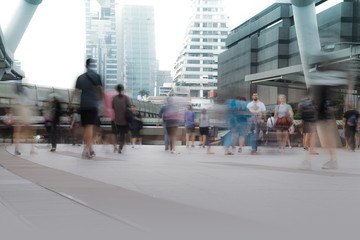 Obraz premium People walking in motion blur in the city