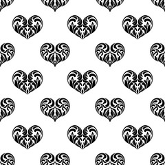 Seamless pattern. Hearts made in swirls, leaves and floral elements isolated on a white background