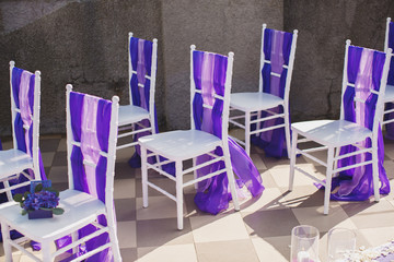 Wedding arch of purple color on the background of the sea.